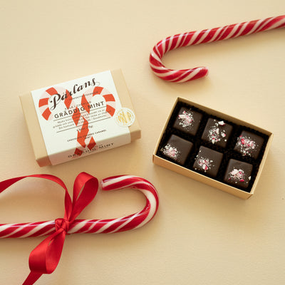 An charming box pieces of your favourite chocolate covered caramel. Treat yourself or someone you love! <br><br>CREAMY MINT – A smooth chocolate-coated caramel, topped with a shivery sweet crunch of mint candy cane. Just the perfect combo of caramel, cream and mint!
