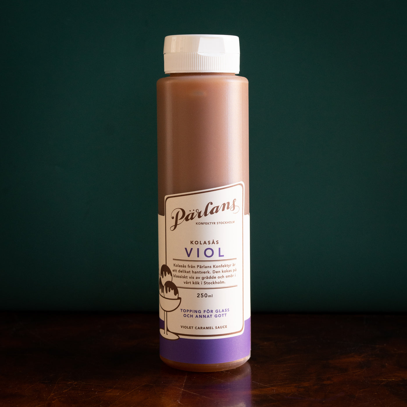 Our delicious caramel sauce in a handy squeeze bottle. Drizzle this glory over ice-cream or your other favourite desserts.<br><br>VIOLET – A delicate bouquet of flower and nectar, with a hint of liquorice, this caramel sauce is unassumingly sweet and lovely, like rain on spring day. 